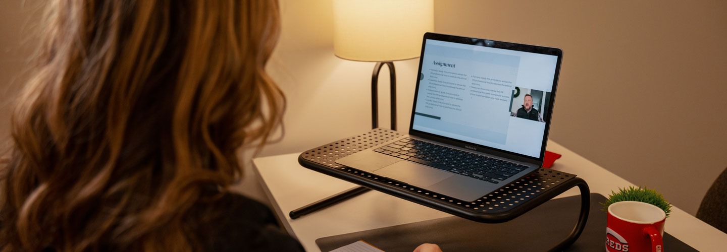 Student working on online course work at home