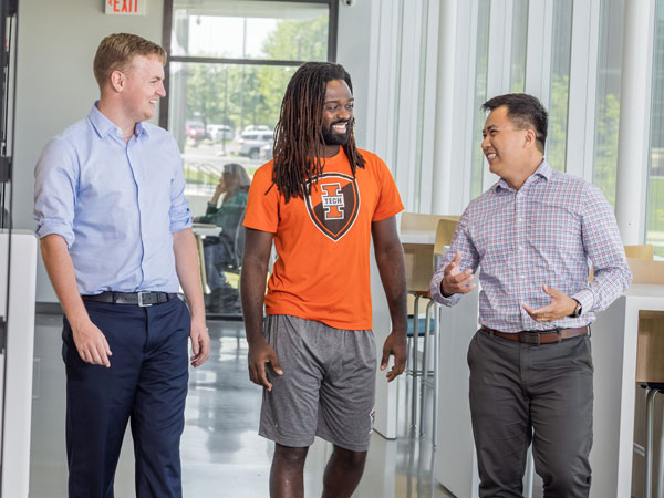 Lewis Roberts, Sam Bodley, and Dr. Thomas Tran walking in the Zollner Engineering Center