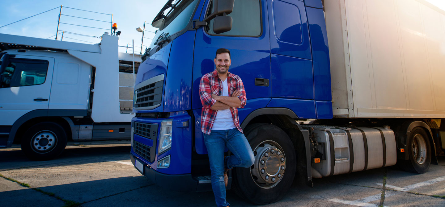 Driver standing with his truck