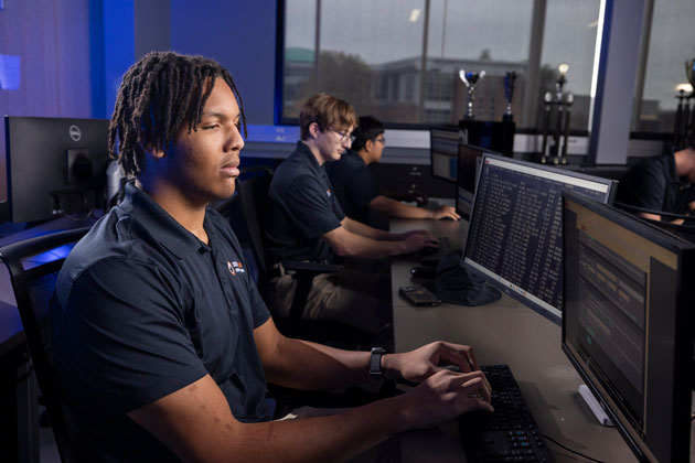 Cyber Warriors team practicing in their lab
