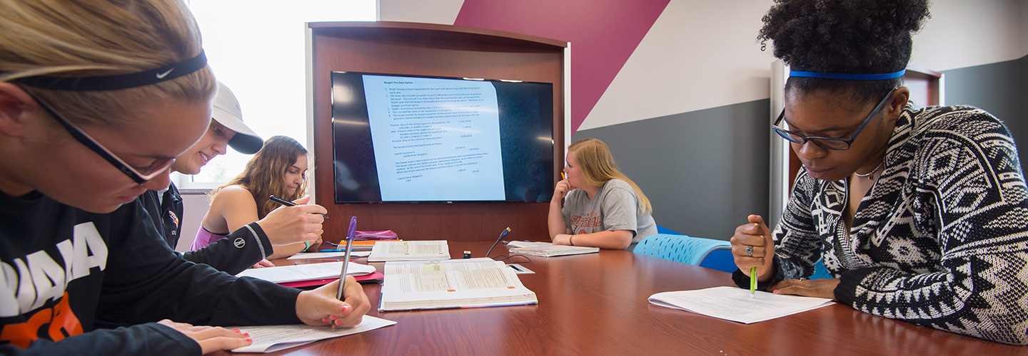 Students working on projects in Accounting with Professor Brown